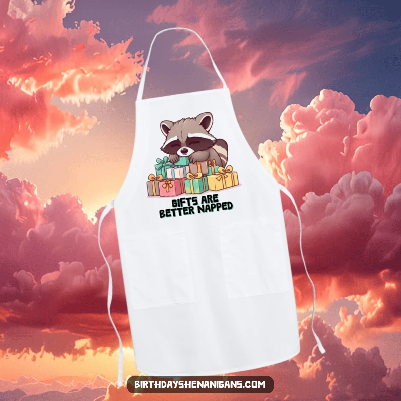 Funny Raccoon Apron: A sleepy raccoon naps on presents, adding a humorous and gentle touch to kitchen wear.
