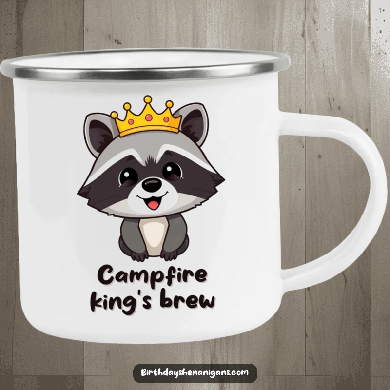 Funny camping mug with a happy raccoon character wearing a festive crown, adding a touch of regal humor to outdoor activities.