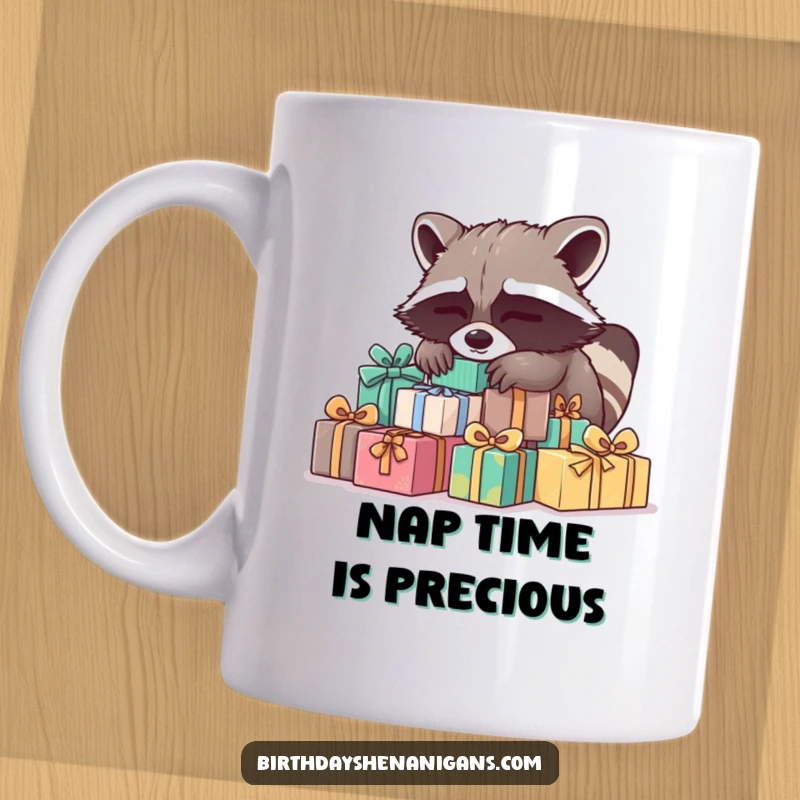 Funny Raccoon Mug: A sleepy raccoon naps on presents, embodying exhaustion and peace, a perfect funny gift.