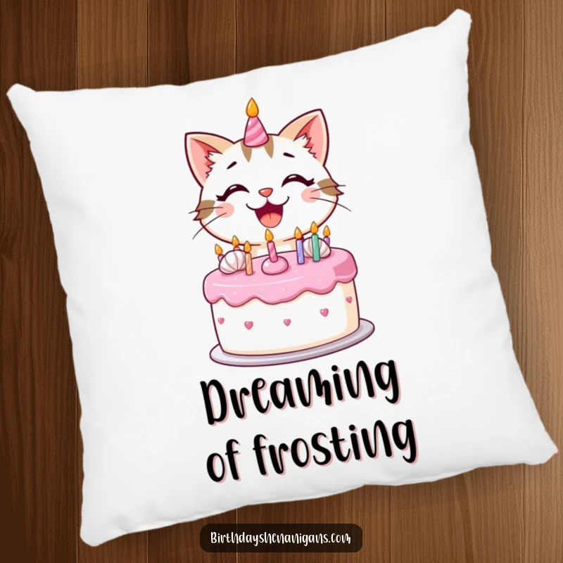 Funny kawaii cat with a big smile decorating a birthday cake with frosting on a plush pillow.
