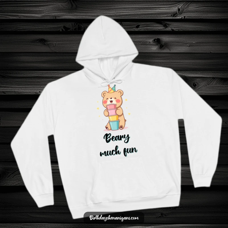 Funny Bear Hoodie: A cute bear character gleefully stacking colorful party cups, looking joyful.