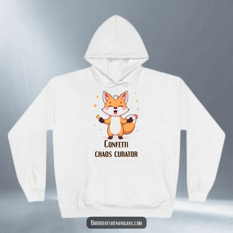 Funny hoodie featuring a gleeful fox artistically juggling bright party poppers, creating a joyful and energetic scene.