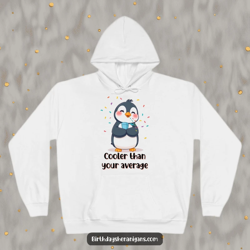 Funny hoodie featuring a wobbly penguin enthusiastically firing a confetti popper, perfect for cozy celebrations.