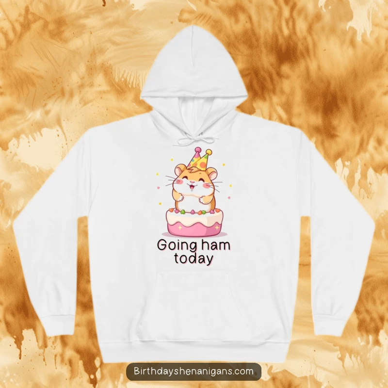 Funny Kawaii hamster wearing a party hat, spinning gleefully on a cake, cozy hoodie design for maximum comfort and fun.