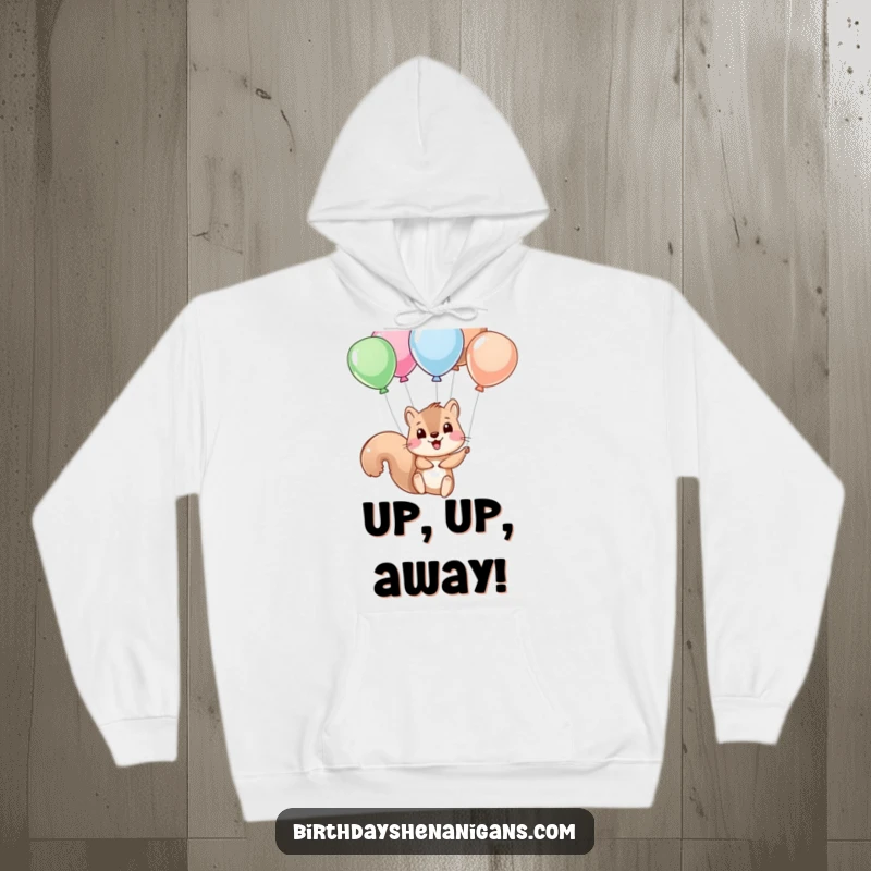Funny squirrel character hanging from balloon strings, depicted on a soft hoodie for ultimate comfort and humor.