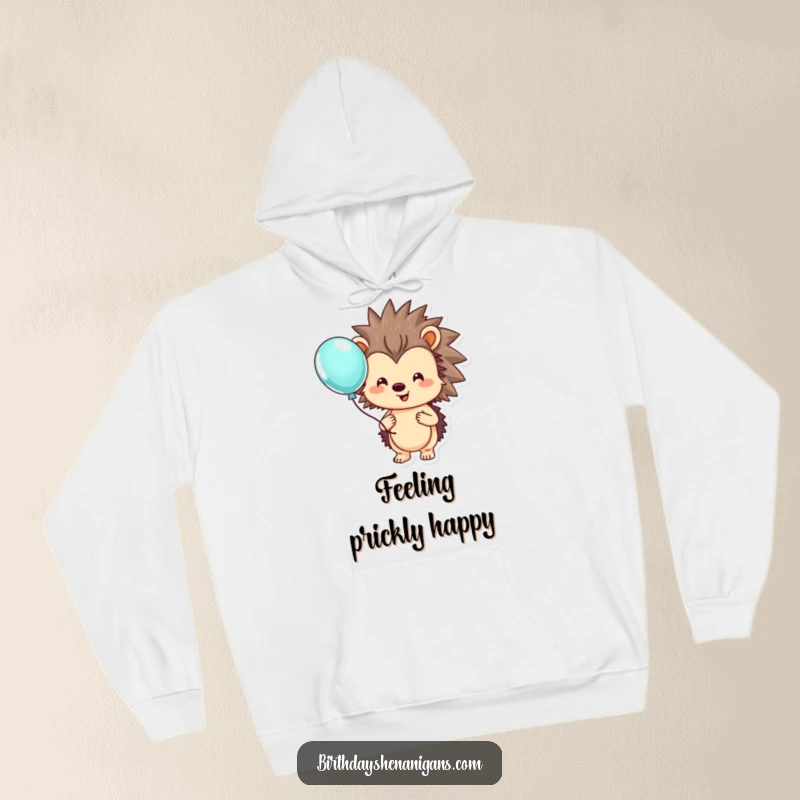 Funny hedgehog hoodie showing a smiling, lovable character holding a single, colorful balloon, symbolizing happiness.