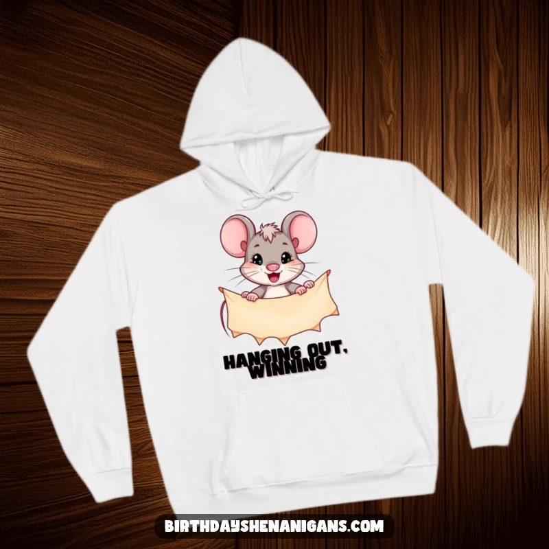 Funny hoodie featuring a highly motivated mouse character carefully hanging a decorative banner, radiating focused energy.