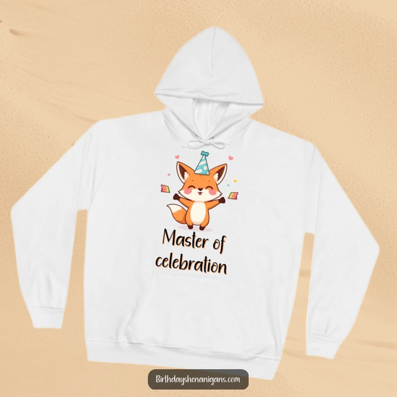 Funny kawaii fox character enthusiastically juggling party hats on a cozy hoodie, offering warmth and a festive, playful spirit.