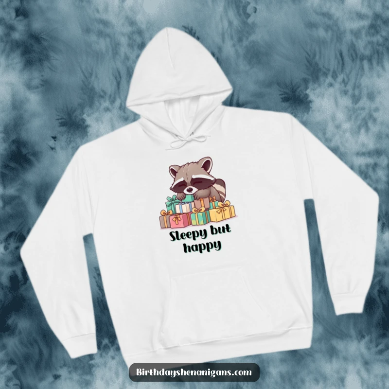 Funny Raccoon Hoodie: A sleepy raccoon dreams on presents, offering ultimate comfort and warmth, a perfect funny gift.