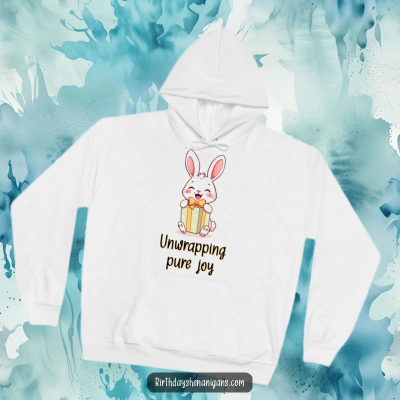 Funny Rabbit Gift Hoodie: A cheerful rabbit joyfully unwraps a bright gift, offering hilarious comfort and warmth.