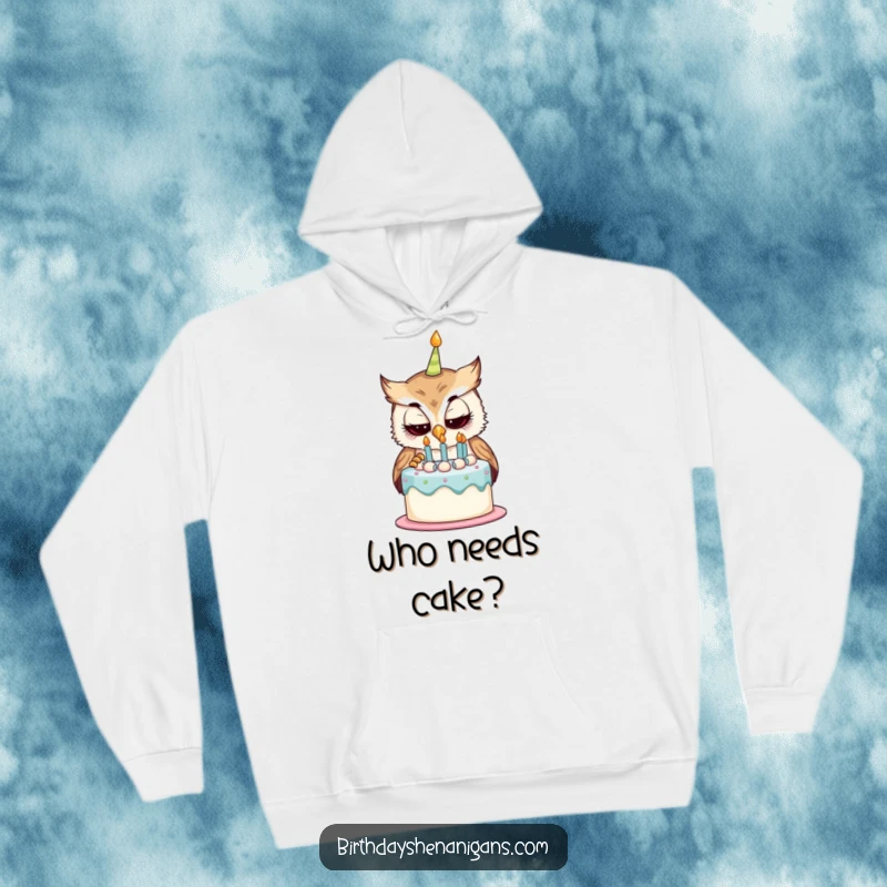 Funny hoodie featuring a curious owl character examining a birthday cake, perfect for staying warm with a touch of playful curiosity.