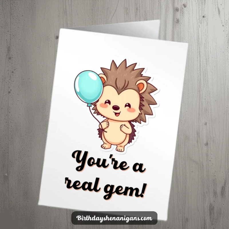 Funny Free Printable Congratulations Card: A smiling hedgehog holds a colorful balloon, symbolizing happy achievements.