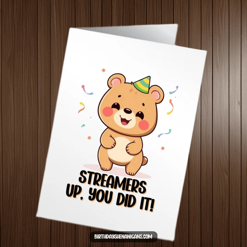 Funny free printable congratulations card with a bear juggling party streamers, perfect for any celebratory occasion, downloadable art.