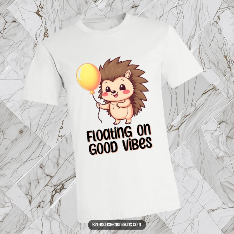 Funny t-shirt with a cute hedgehog character holding a vibrant, colorful balloon, symbolizing joy and lighthearted fun.