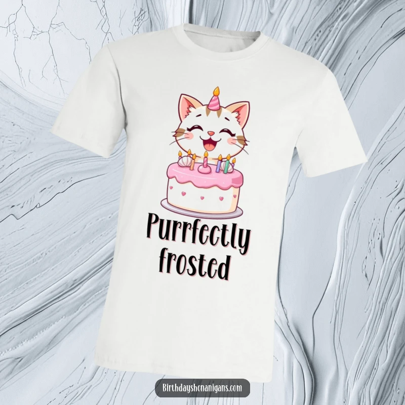 Funny kawaii cat with a huge smile frosting a birthday cake, printed on a t-shirt for a humorous vibe.