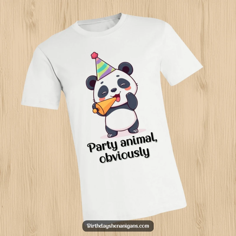 Funny panda t-shirt, joyful, wearing party hat, blowing noisemaker, celebrating humorously, festive spirit.