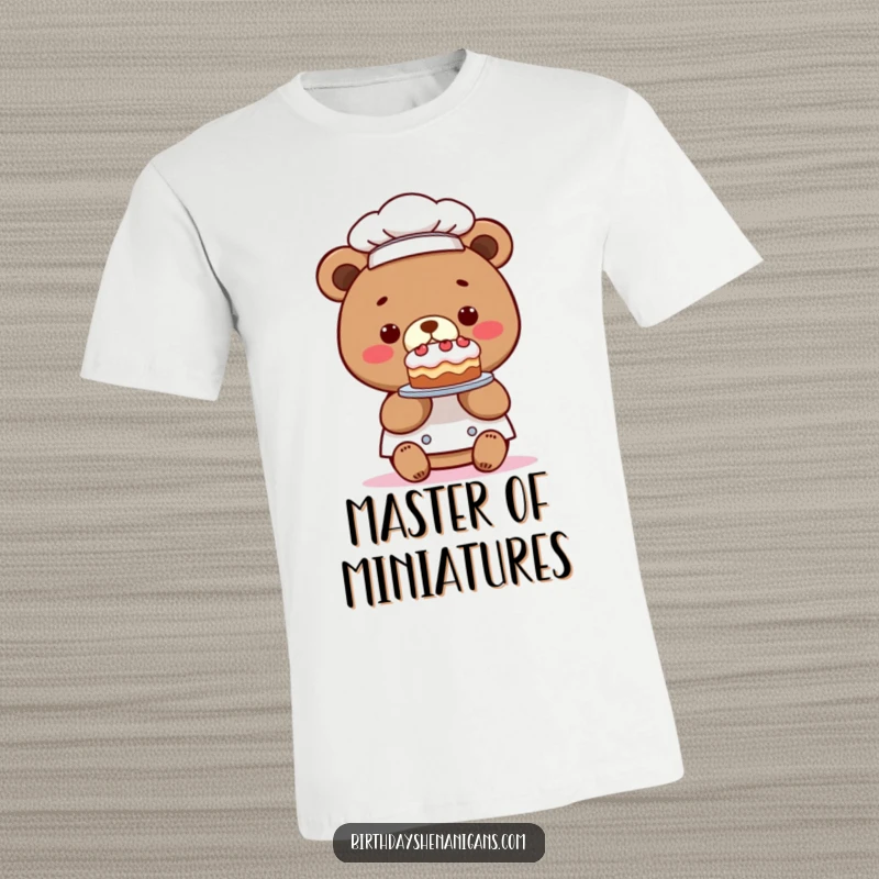 Funny t-shirt featuring a kawaii bear chef presenting a comically tiny cake, a whimsical and humorous design for bakers, a perfect funny gift.
