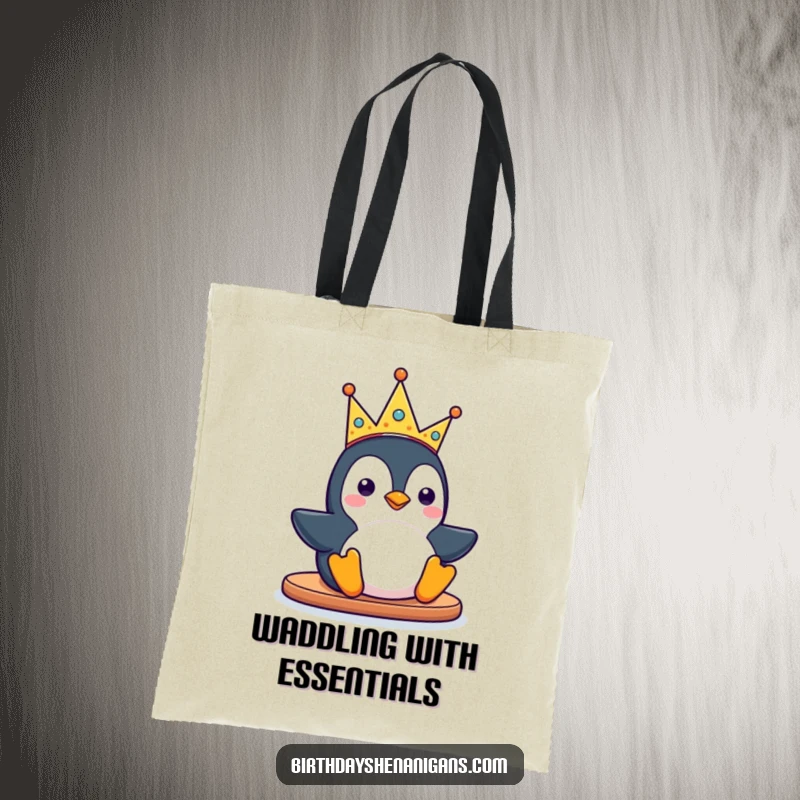 Funny kawaii penguin character sliding with a silly party crown on a tote bag, perfect for carrying items with a dose of playful charm.